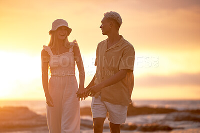 Buy stock photo Love, sunset and couple holding hands at beach for tropical holiday adventure, relax and bonding together. Evening, happy man and woman on romantic date with ocean, sky or walking on outdoor vacation