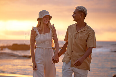 Buy stock photo Love, sunset sky and couple holding hands at beach for tropical holiday adventure, relax and bonding together. Evening, happy man and woman on romantic date with ocean, walking and outdoor vacation