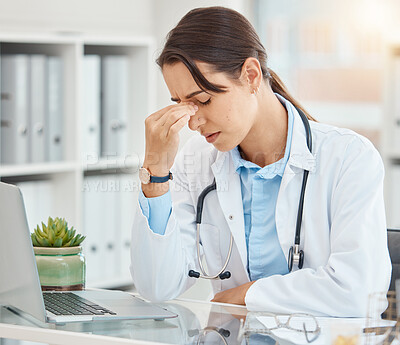 Buy stock photo Stress, depression and tired female doctor suffering from a headache or mental health while sitting in an office with laptop. Frustrated, upset and overworked healthcare or medical worker in hospital