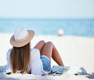 Buy stock photo Travel, beach and woman relax by ocean for summer vacation, holiday and tropical island. Nature, tourism and person on towel sunbathing for resting at seaside, sunshine and adventure in Hawaii