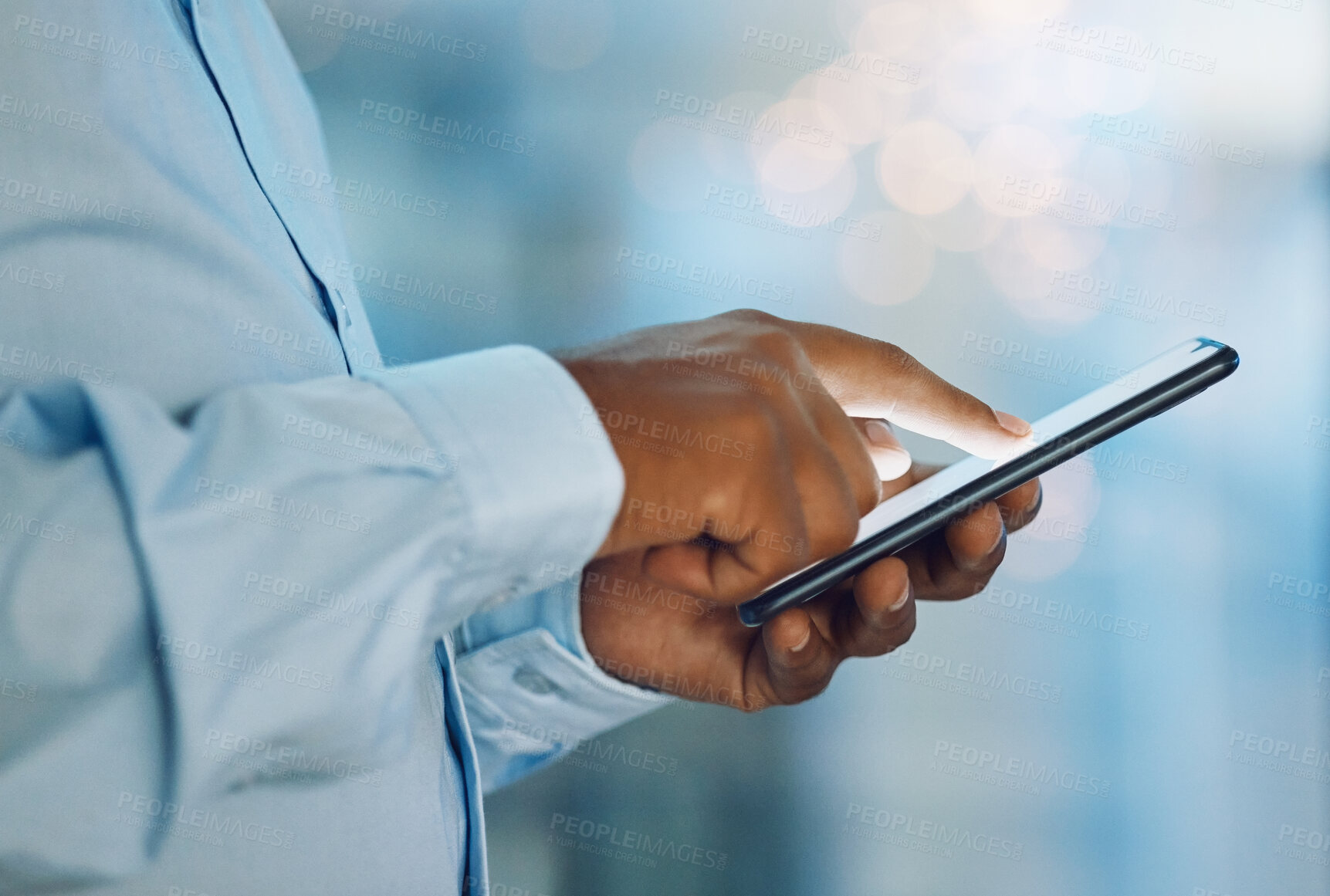 Buy stock photo Black man, hands and browsing with phone for news, social media or online research at office. Closeup of African, male person or employee on mobile smartphone for chatting, texting or scrolling app