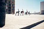 Soccer, sports and fitness with a team stretching on a rooftop court before a game or match outdoor. Football, training and health with a man and woman athlete group getting ready to play a sport