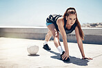 Soccer ball, stretching and woman in fitness workout, training and exercise on rooftop with music earphones. Football player, sports person and athlete listening to motivation podcast or health radio