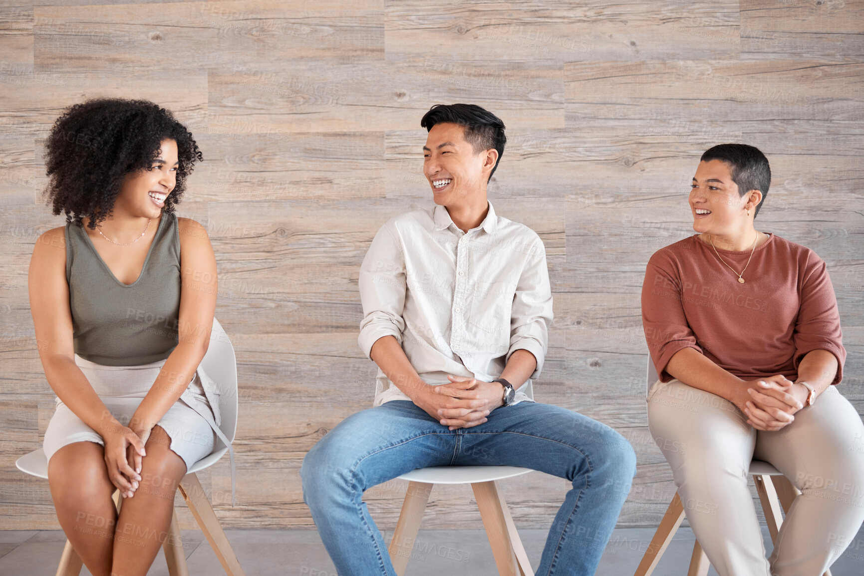 Buy stock photo Diversity, people and sitting on chair in queue, excited job interview or recruitment meeting, communication and conversation of employee engagement. Happy group in waiting room of hiring opportunity