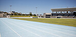 Race track, athletic and empty outdoor sports stadium for marathon, competition or contest. Sport, no people and field at outside arena for training, exercise or workout for professional athletes.