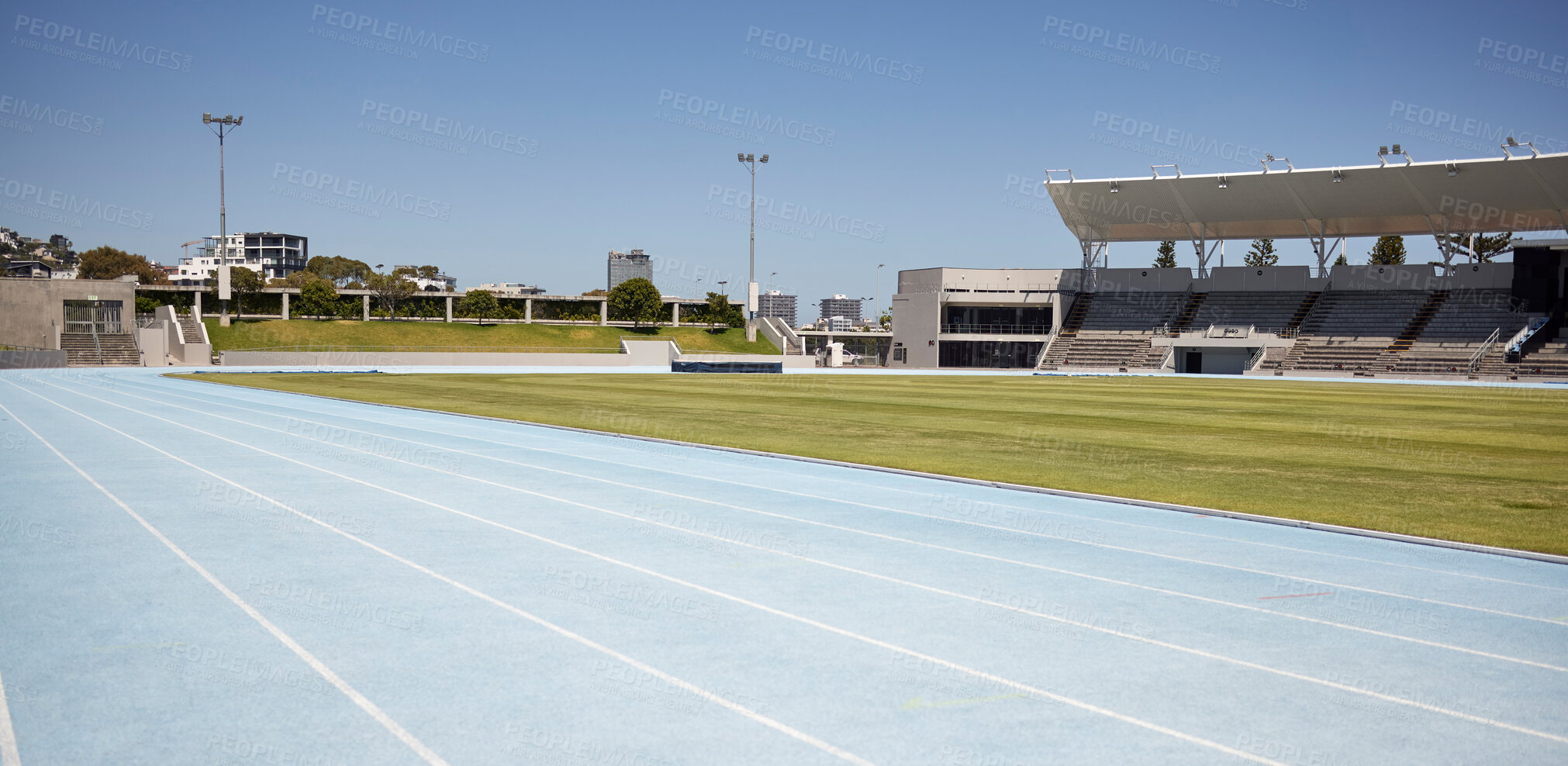 Buy stock photo Race track, athletic and empty outdoor sports stadium for marathon, competition or contest. Sport, no people and field at outside arena for training, exercise or workout for professional athletes.