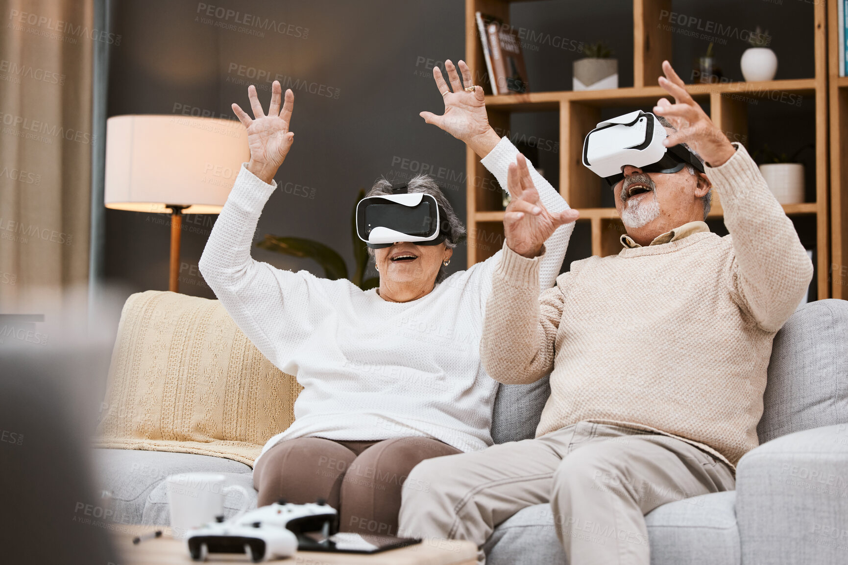 Buy stock photo Gaming, virtual reality and senior couple with headset play online game with VR, technology and smile. Future, elderly woman and happy man in home watching futuristic augmented reality video on sofa.
