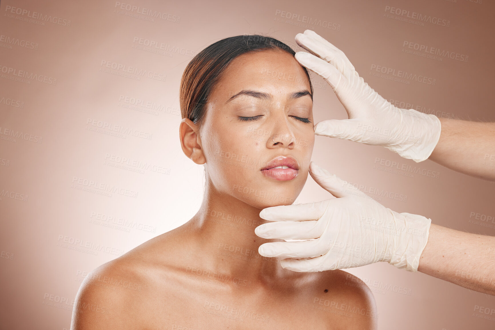 Buy stock photo Plastic surgery, woman and doctor hands check face for beauty implant and makeup cosmetics. Skincare consultation, facial and gloves for aesthetics, filler and body change on studio background