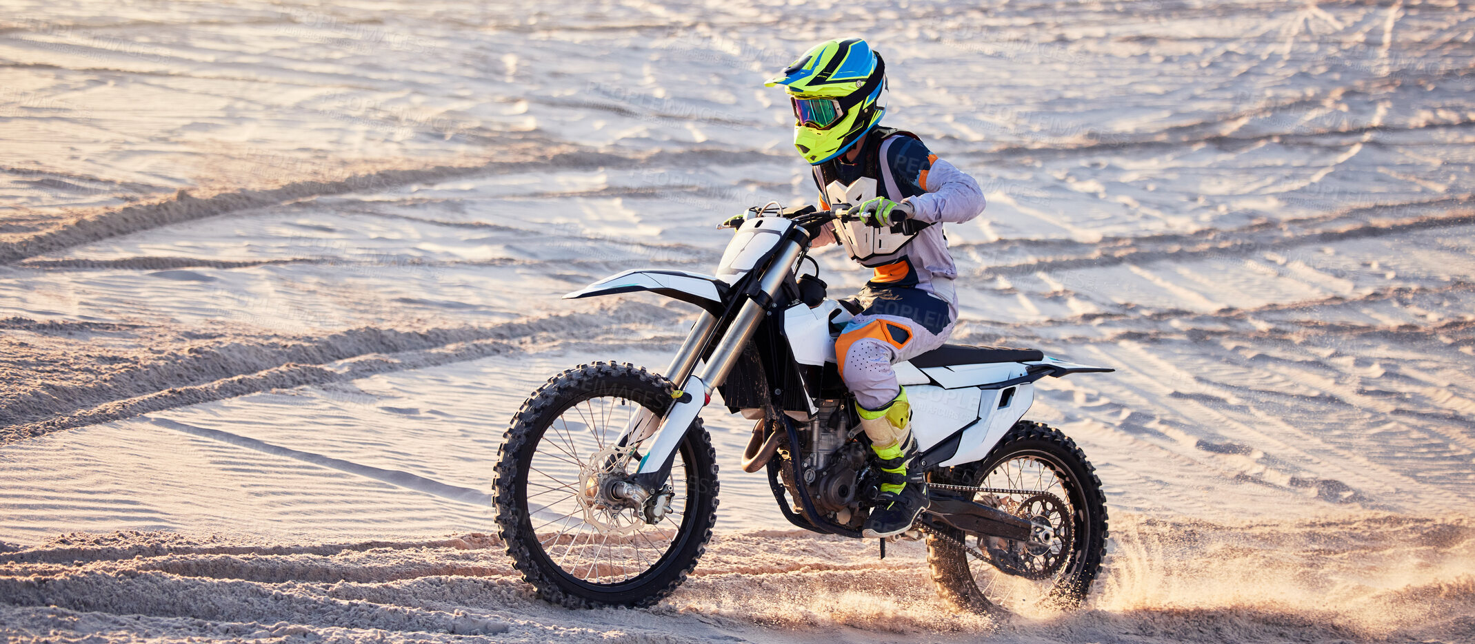 Buy stock photo Motorcycle, desert race and extreme sport expert with agile speed, power or balance in nature. Motorbike man, rally and sand on fast vehicle with helmet, safety clothes and motivation for motorsport