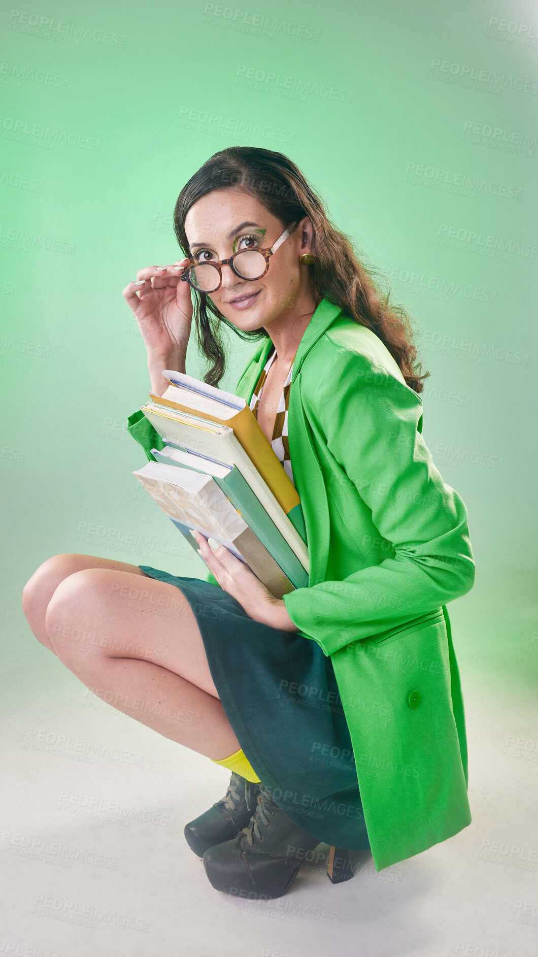 Buy stock photo Model woman, nerd fashion and studio portrait in vintage glasses, books or makeup for trippy green aesthetic. Gen z girl student, 80s retro clothes and geek studying with beauty by blurred background