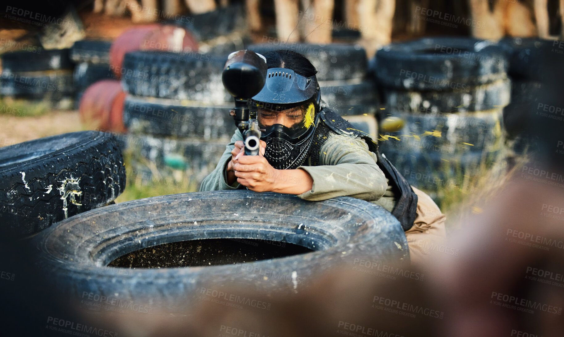 Buy stock photo Paintball, person aim gun at target and military tactics, shooting range and war game for sports outdoor. Soldier with weapon on battlefield, action and camouflage, helmet for safety and adventure