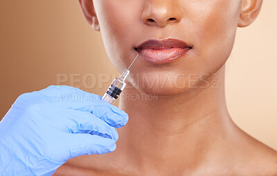 Buy stock photo Lip filler, beauty or lips of Indian woman with injection for plastic surgery, cosmetics in studio. Skincare, dermatology or zoom of girl with needle in mouth, face lift or facial treatment