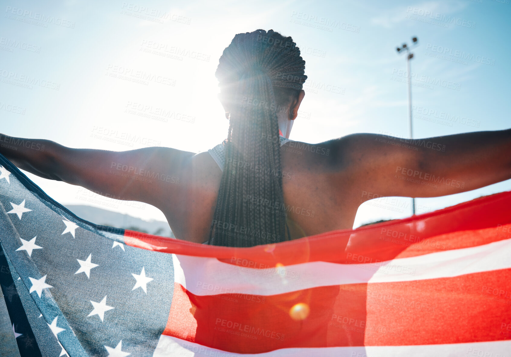 Buy stock photo Athlete, American flag and sports with a woman outdoor at a stadium to celebrate country, pride and win. Back of a person for sport event , fitness and exercise achievement at competition in USA