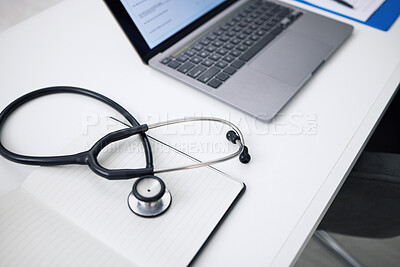 Buy stock photo Stethoscope, laptop and desk for healthcare background, medical research and hospital services or planning. Computer, heart equipment and clinic information, cardiology or telehealth in empty office