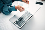 Person, hands and laptop with documents in finance, budget planning or investments on office desk. Closeup of employee or accountant pointing to computer with financial paperwork, bills or expenses