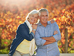 Portrait, outdoor and old couple with love, hug and smile with romance, sunshine and relationship. Nature, man and woman in park, embrace or marriage with happiness, retirement and support with peace