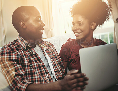 Buy stock photo Home, smile and black couple with laptop, sunshine and connection with internet, relaxing and lens flare. Apartment, streaming service and man with woman, computer and happiness with marriage or love