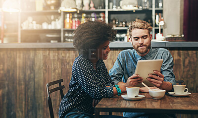 Buy stock photo Smile, man and woman in cafe with tablet, social media, relax and networking connection at table. Date, weekend conversation and happy couple in coffee shop with digital app, drink and online search