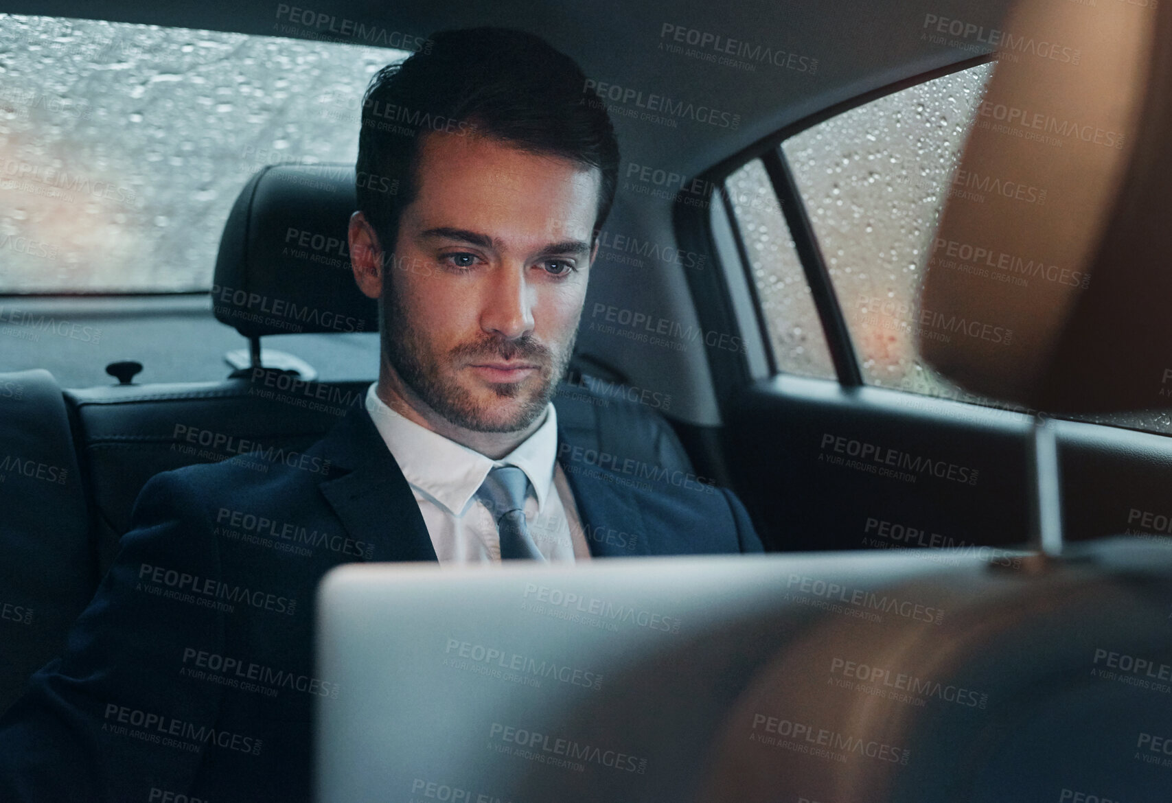 Buy stock photo Businessman, car and laptop for transportation service or work travel to meeting, airport or report. Male person, backseat and entrepreneur for tech company or city chauffeur for trip, cab or taxi