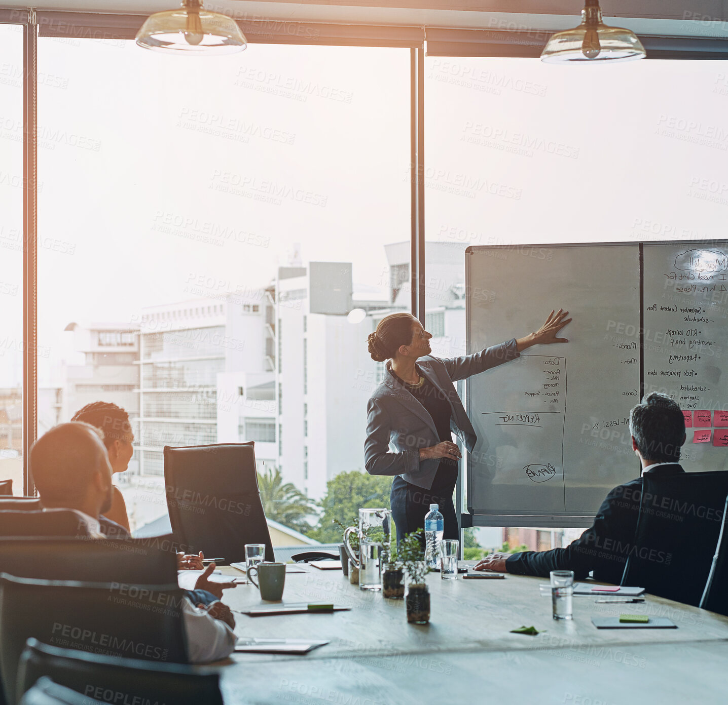 Buy stock photo Meeting, whiteboard and woman leader with presentation in office for planning, schedule or project management. Speaker, coaching and manager hand pointing to sale objectives, note or target priority