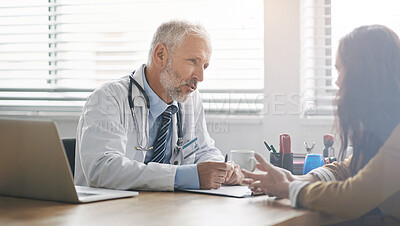 Buy stock photo Mature doctor, patient and consulting with discussion in hospital office for medical feedback, diagnosis or results. Healthcare, woman and expert with clipboard for approval of anti aging treatment