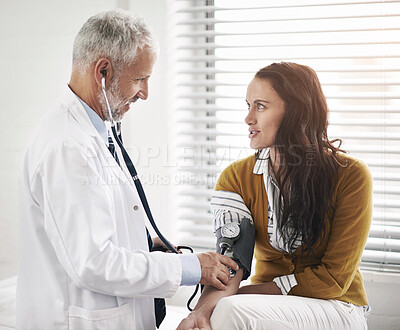 Buy stock photo Doctor, blood pressure and woman patient at hospital with medical consultation for health insurance. Healthcare, stethoscope and check pulse for medical exam, wellness and hypertension diagnosis