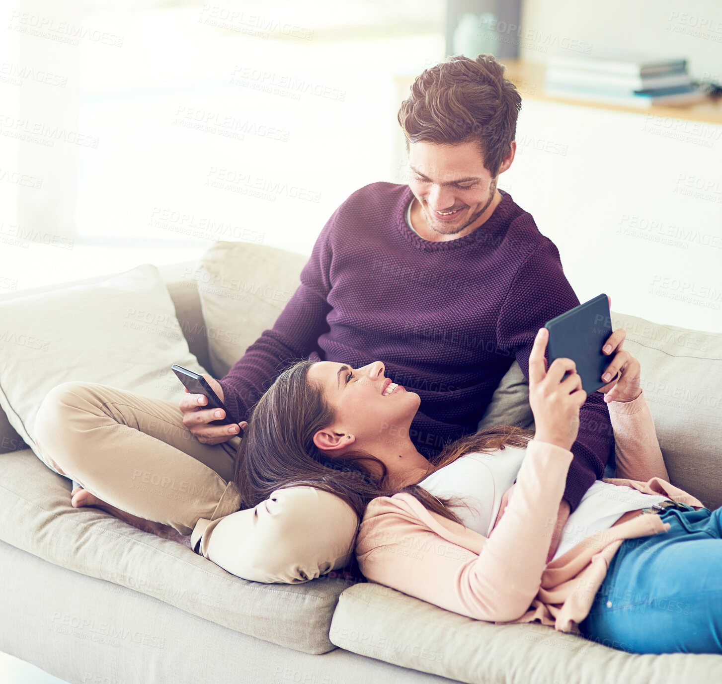 Buy stock photo Smile, couple and relax on sofa with technology for social media, movie or streaming video together. Tablet, man and woman in living room for online shopping or reading blog on mobile app in home