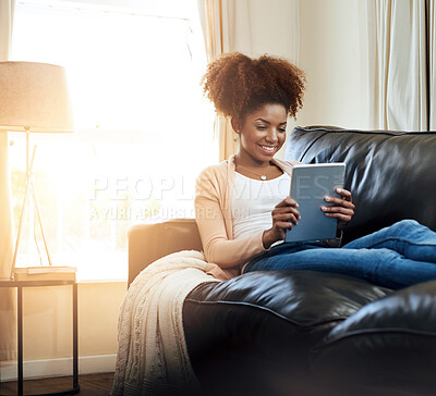 Buy stock photo Home, relax and black woman with tablet, smile and connection with lens flare, social media and digital app. African person, apartment or happy girl on couch, technology and internet with online news