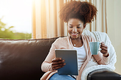 Buy stock photo Tablet, coffee and happy black woman in home to relax, reading blog or morning news on sofa. Smile, tea and girl on digital technology on social media, streaming show or watch online drama with drink