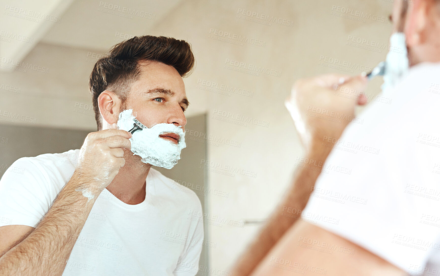 Buy stock photo Man, mirror and shaving cream on face in bathroom for grooming, skincare or morning routine. Reflection, beard foam and person with razor for cleaning, health or hair removal for hygiene in home