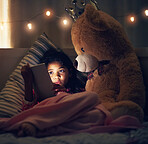 Night, teddy bear and girl with tablet, kid and relaxing with screen light, online reading and social media. Bedroom, home and child with tech, stuffed animal and dark with internet and digital app