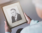 Picture, frame and hand of elderly woman with memory for nostalgia, family history and melancholy. Senior person, retirement and lonely with man in photo for grief, reminisce and loss of husband