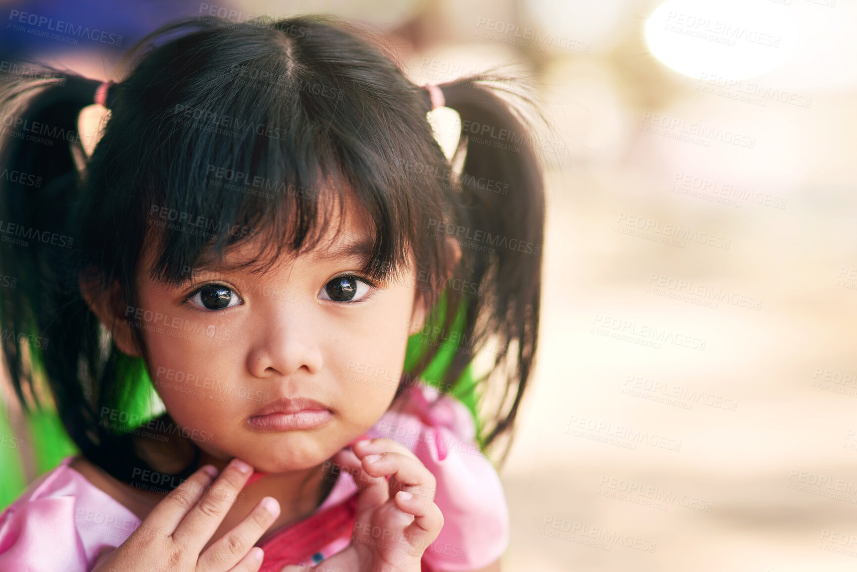 Buy stock photo Portrait, outdoor and girl with sunshine, kid and facial with weekend break, innocent and calm. Face, sad and childhood development in park, youth and relaxing with peace, expression and summer