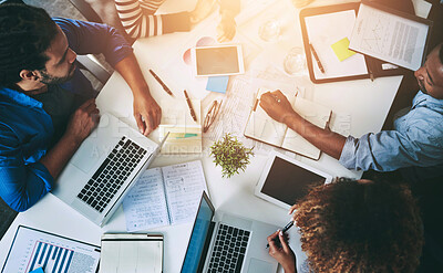 Buy stock photo Meeting, laptop and business people with documents in office for teamwork, idea or planning. Above, diversity and staff with book for report, discussion or deadline at printing firm with lens flare