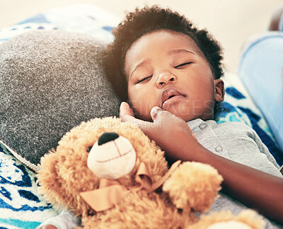 Buy stock photo Tired, baby and sleeping with teddy bear on bed for child development, comfortable and resting. Black family, kid and hand of parent with dreaming in nursery for peace, growth and calm at home