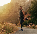 Man, mountain and exercise with headphones in stretching for fitness, training and workout music. Male person, thinking and runner in nature with preparation for sport, balance or podcast for warm up
