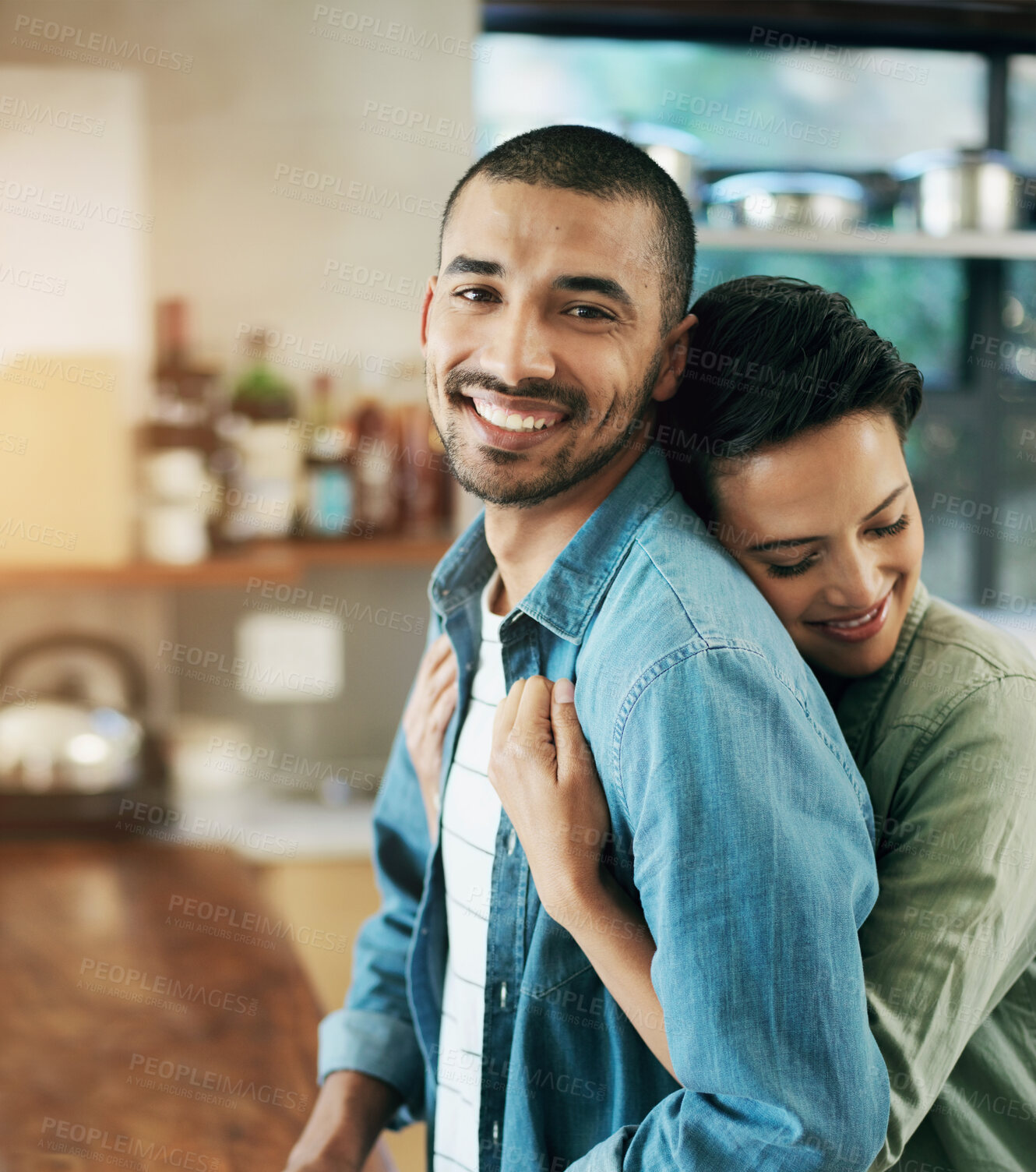 Buy stock photo Affectionate, hug and happy couple in kitchen for love, cooling and bonding together with evening date. Smile, romantic man with woman for relationship, support or comforting embrace in home