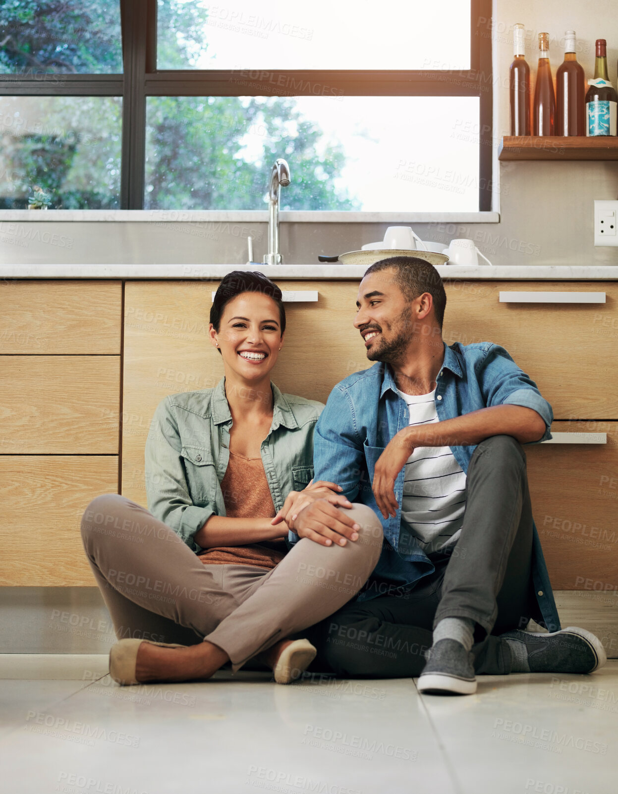 Buy stock photo Couple, smile and kitchen floor with happy for weekend or break with love in home for bonding with laugh. New, house and proud with relax from renovations for interior with date night or romance.