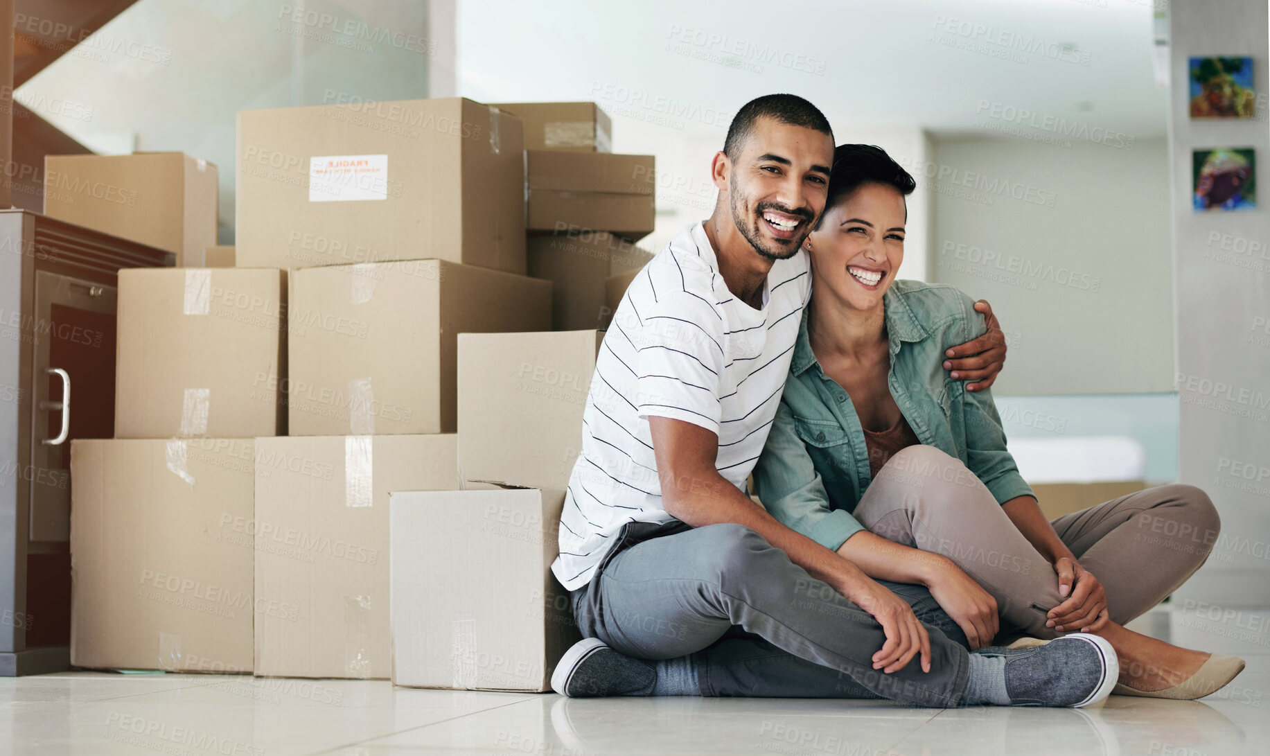 Buy stock photo Happy couple, portrait and moving to new home with boxes for property investment, real estate or living room. Man, woman and face for mortgage or house insurance for residential, apartment or loan