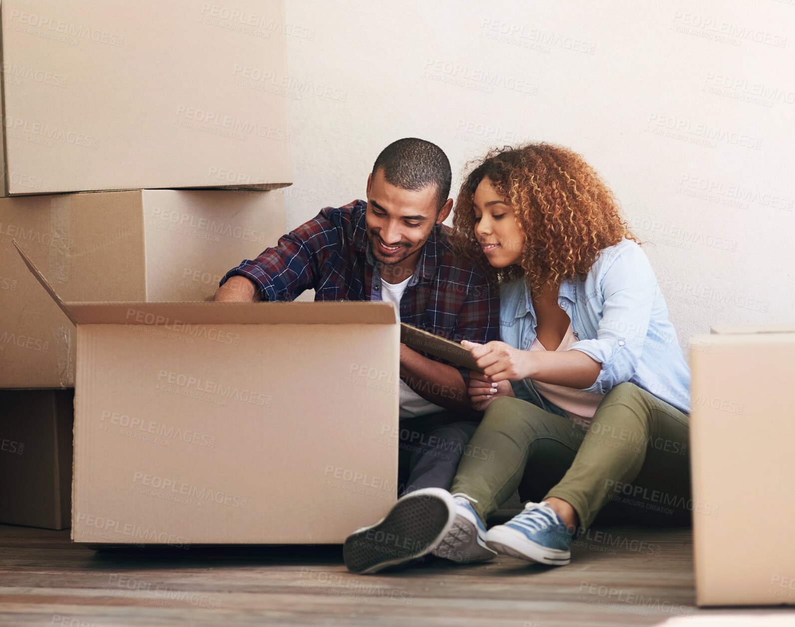 Buy stock photo New home, boxes and couple on floor, real estate and property with package, moving in and search for items. Apartment, man and woman on ground, cardboard and relocation with achievement and happiness