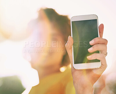 Buy stock photo Outdoor, woman and smartphone with screen, sunshine and lens flare with mobile user, mockup and connection. Hand, person and girl with cellphone, technology and social media with communication