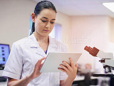 Buy stock photo Woman, scientist and online on tablet in laboratory for daily schedule, biotechnology and experiment planning for study or tests. Girl, digital technology and internet for chemistry breakthrough.