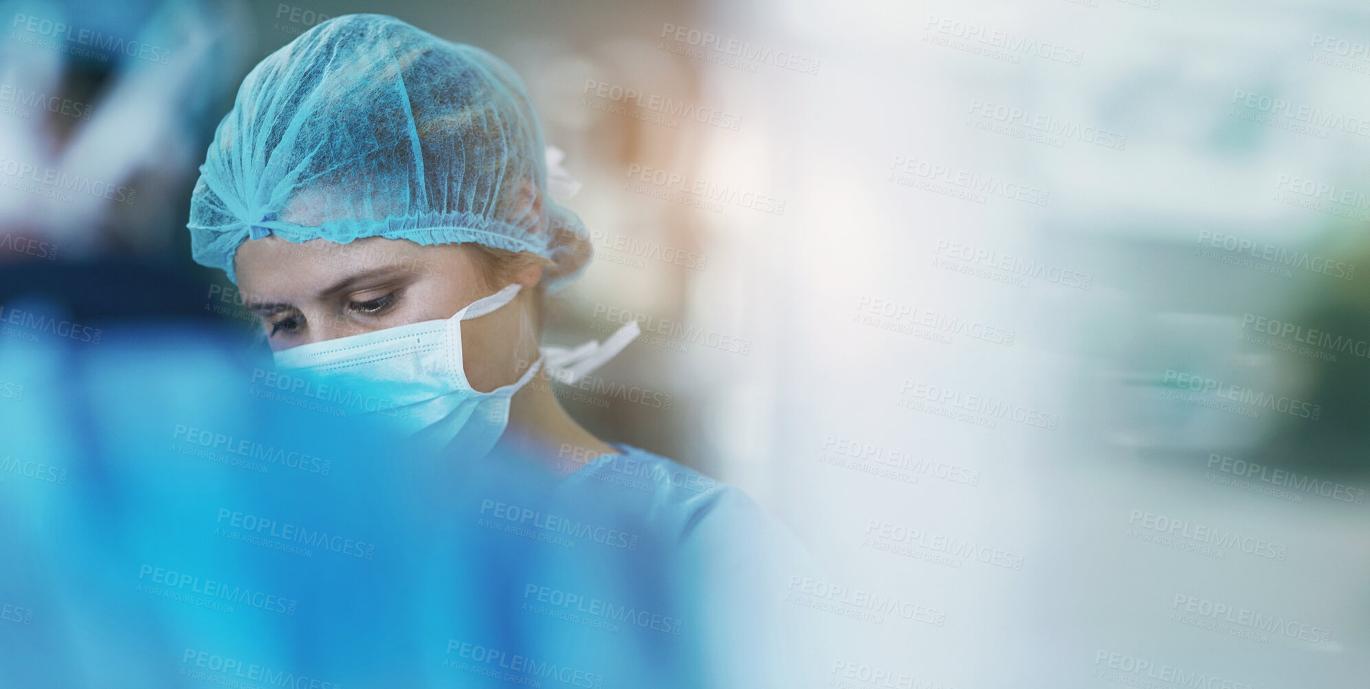 Buy stock photo Health, surgery and doctor with face mask and scrubs in theatre for medical procedure and emergency.  Female person or healthcare professional in operating room for diagnosis and wound dressing