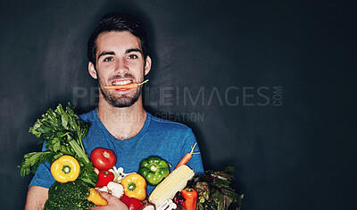 Buy stock photo Man, portrait and studio with vegetables for health or nutrition, vegan with diet for wellness. Male person, groceries and black background for announcement with food or shopping, happy with herbs