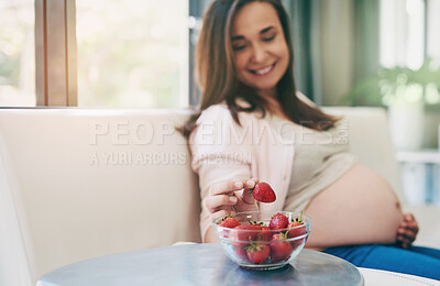 Buy stock photo Woman, pregnant and strawberry for snack in home, nutrition and vitamin for growth of baby. Female person, organic and vegan fruit or food for health, love and healthy diet for maternity on couch