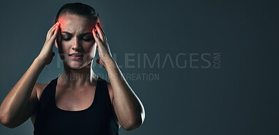 Buy stock photo Woman, headache and burnout on exercise in studio on dark background with head pain or inflammation. Female person, mockup and fatigue from fitness, workout and training for health with red glow