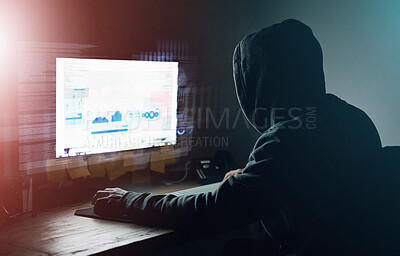 Buy stock photo Dark, office and man at computer for hacking, online programming and cybersecurity at night. Software, developer or hacker in hoodie coding for password, firewall or network access for cyber attack