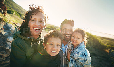 Buy stock photo Holiday, mountain and portrait of family with smile, nature and outdoor bonding together on travel adventure. Mom, dad and children on summer vacation with hiking, happy face and sunshine on hill