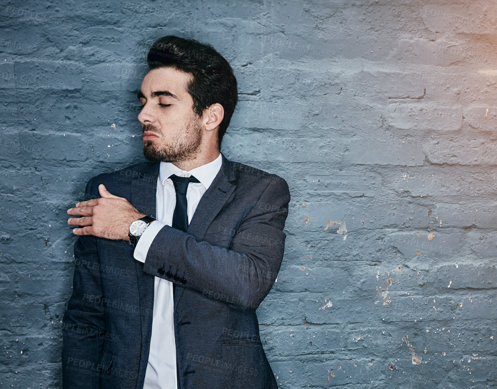Buy stock photo Brush shoulder, confident and business man on wall background for career, job and working. Professional, corporate and entrepreneur in office with attitude, ambition and confidence in workplace