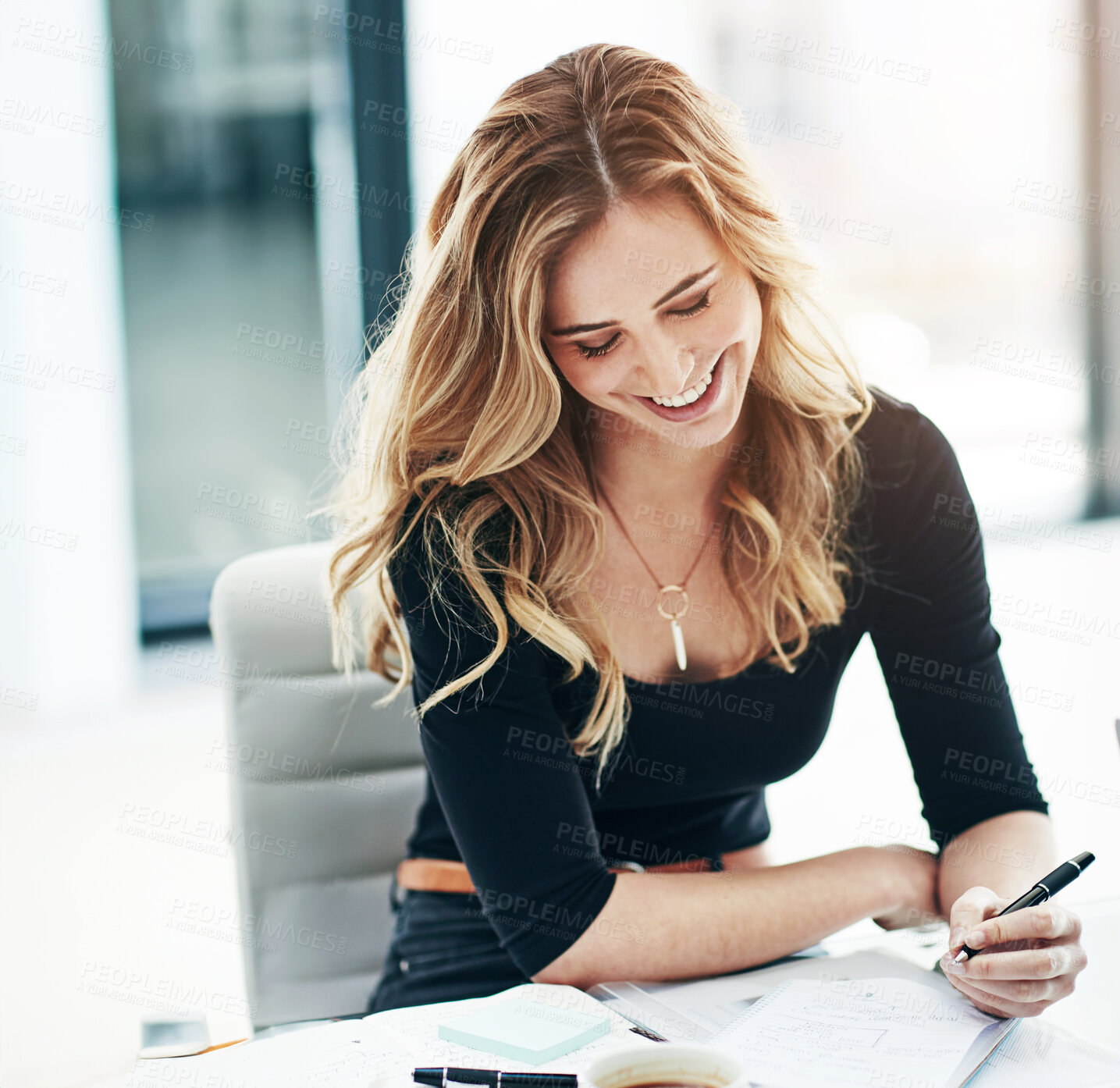 Buy stock photo Happy, business woman and writing with book for schedule planning, tasks or reminder at office. Young female person, designer or employee taking notes with smile for checklist in diary at workplace